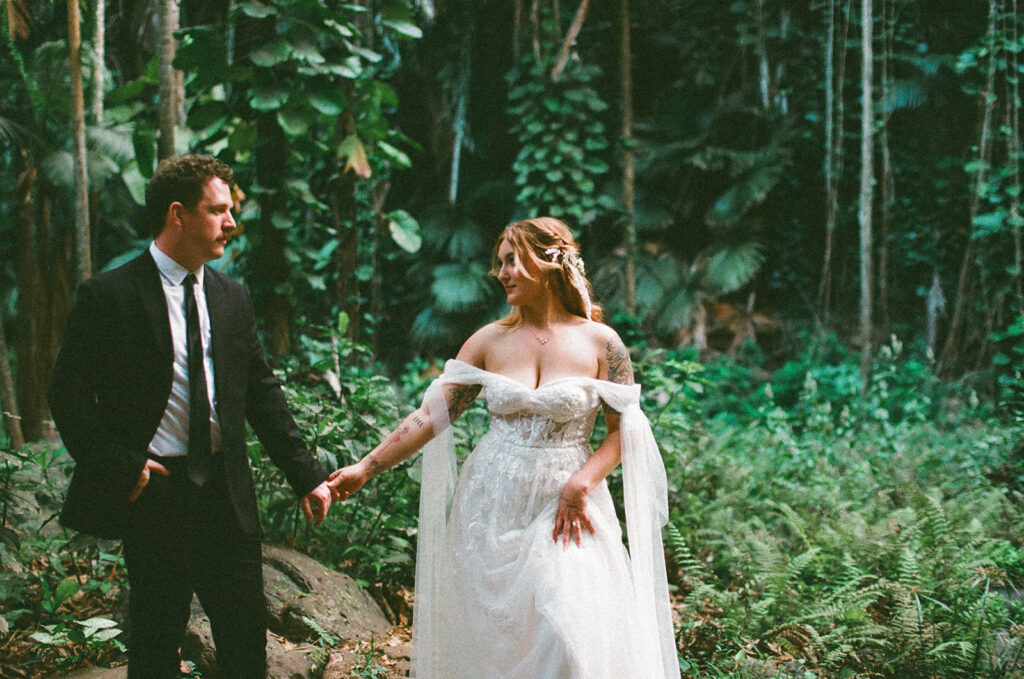 Some elopements feel like they were pulled straight out of a dream, and Courtnee and Joshua’s waterfall elopement in Kauai, Hawaii was exactly that. Surrounded by lush jungle, the sound of rushing water, and the soft island breeze, their day was intentional, intimate, and centered completely around the two of them.