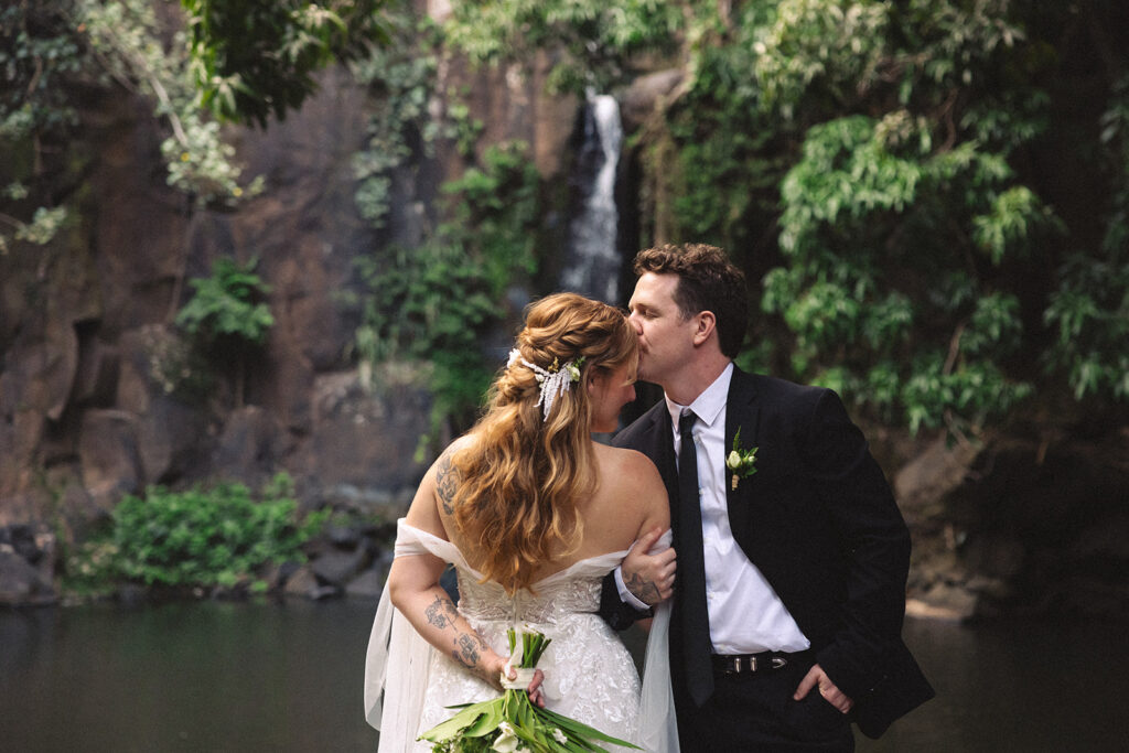 Some elopements feel like they were pulled straight out of a dream, and Courtnee and Joshua’s waterfall elopement in Kauai, Hawaii was exactly that. Surrounded by lush jungle, the sound of rushing water, and the soft island breeze, their day was intentional, intimate, and centered completely around the two of them.
