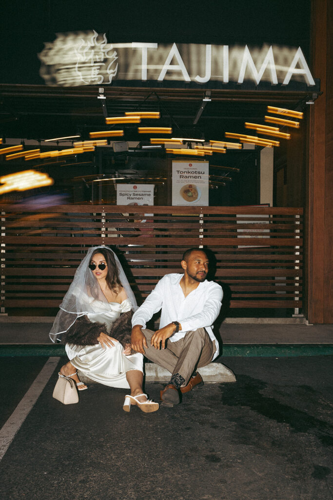 Katie and Karl’s late-night San Diego engagement session was absolutely the latter. These two showed up ready for fun, dressed to the nines, and totally embracing that after-dark, moody, editorial vibe that downtown does so well. It was fashion, flash, and pure personality—exactly what makes nighttime engagement photos so electric. 