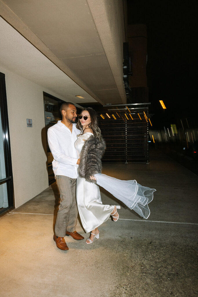 Katie and Karl’s late-night San Diego engagement session was absolutely the latter. These two showed up ready for fun, dressed to the nines, and totally embracing that after-dark, moody, editorial vibe that downtown does so well. It was fashion, flash, and pure personality—exactly what makes nighttime engagement photos so electric. 