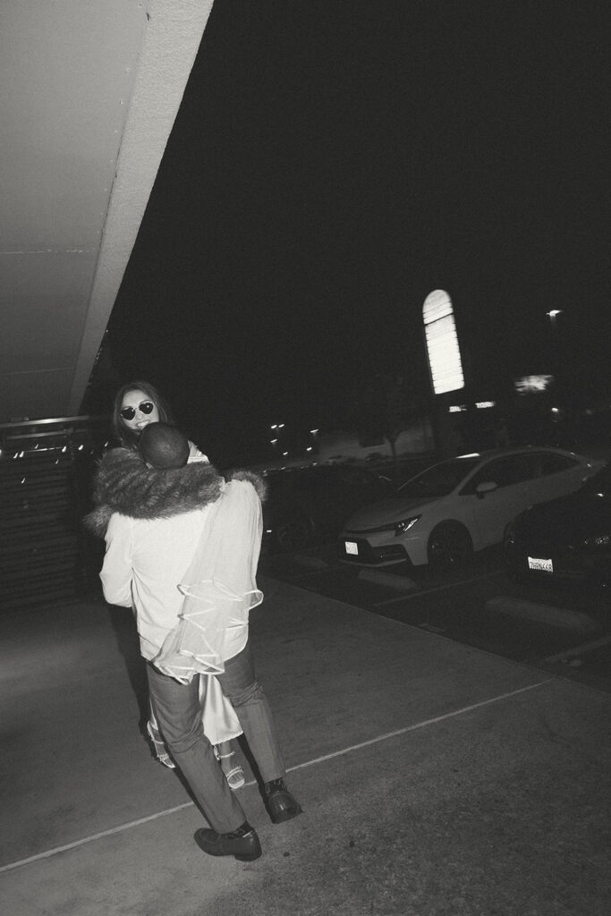 Katie and Karl’s late-night San Diego engagement session was absolutely the latter. These two showed up ready for fun, dressed to the nines, and totally embracing that after-dark, moody, editorial vibe that downtown does so well. It was fashion, flash, and pure personality—exactly what makes nighttime engagement photos so electric. 