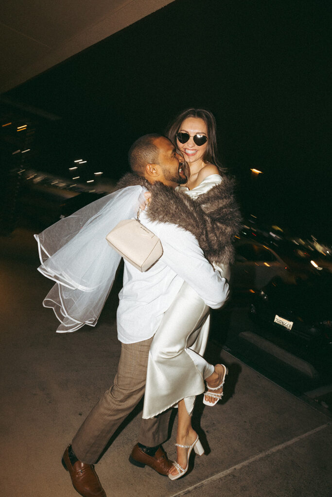 Katie and Karl’s late-night San Diego engagement session was absolutely the latter. These two showed up ready for fun, dressed to the nines, and totally embracing that after-dark, moody, editorial vibe that downtown does so well. It was fashion, flash, and pure personality—exactly what makes nighttime engagement photos so electric. 