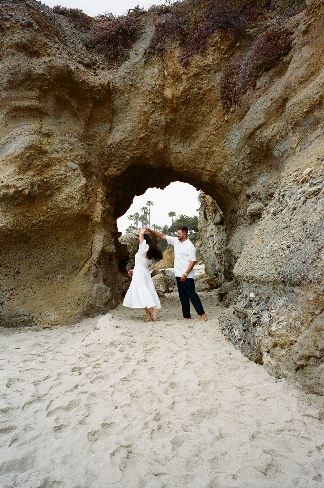 This Orange County engagement session blends vintage car style with relaxed Southern California beach vibes. Shot on both digital and 35mm film, this gallery is full of inspiration from Tia Leigh Photography for couples looking for a San Diego or Southern California engagement photographer who creates a mix of editorial, romantic, and candid images.