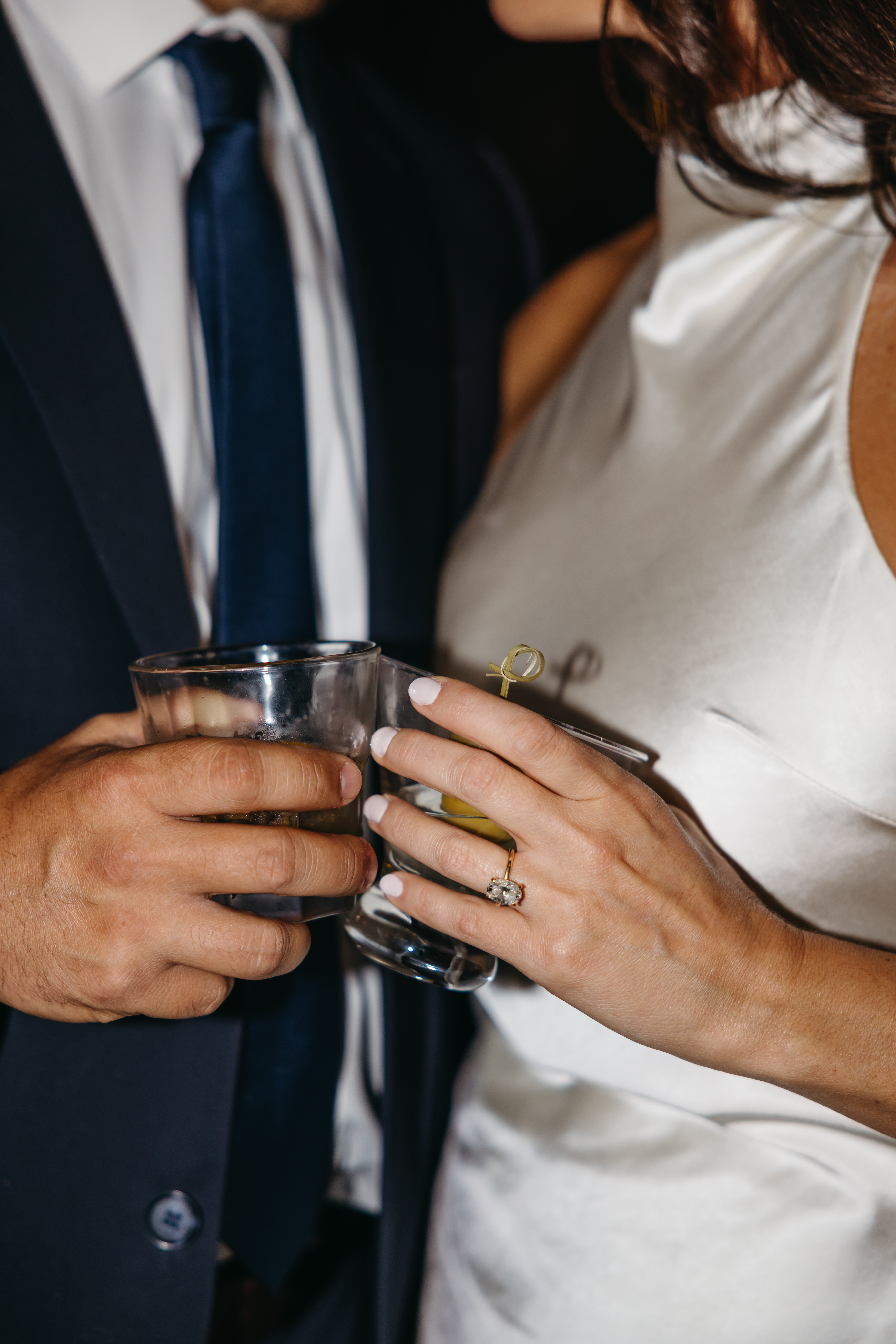 Couple sitting at a dimly lit bar sharing drinks during engagement session in Scranton