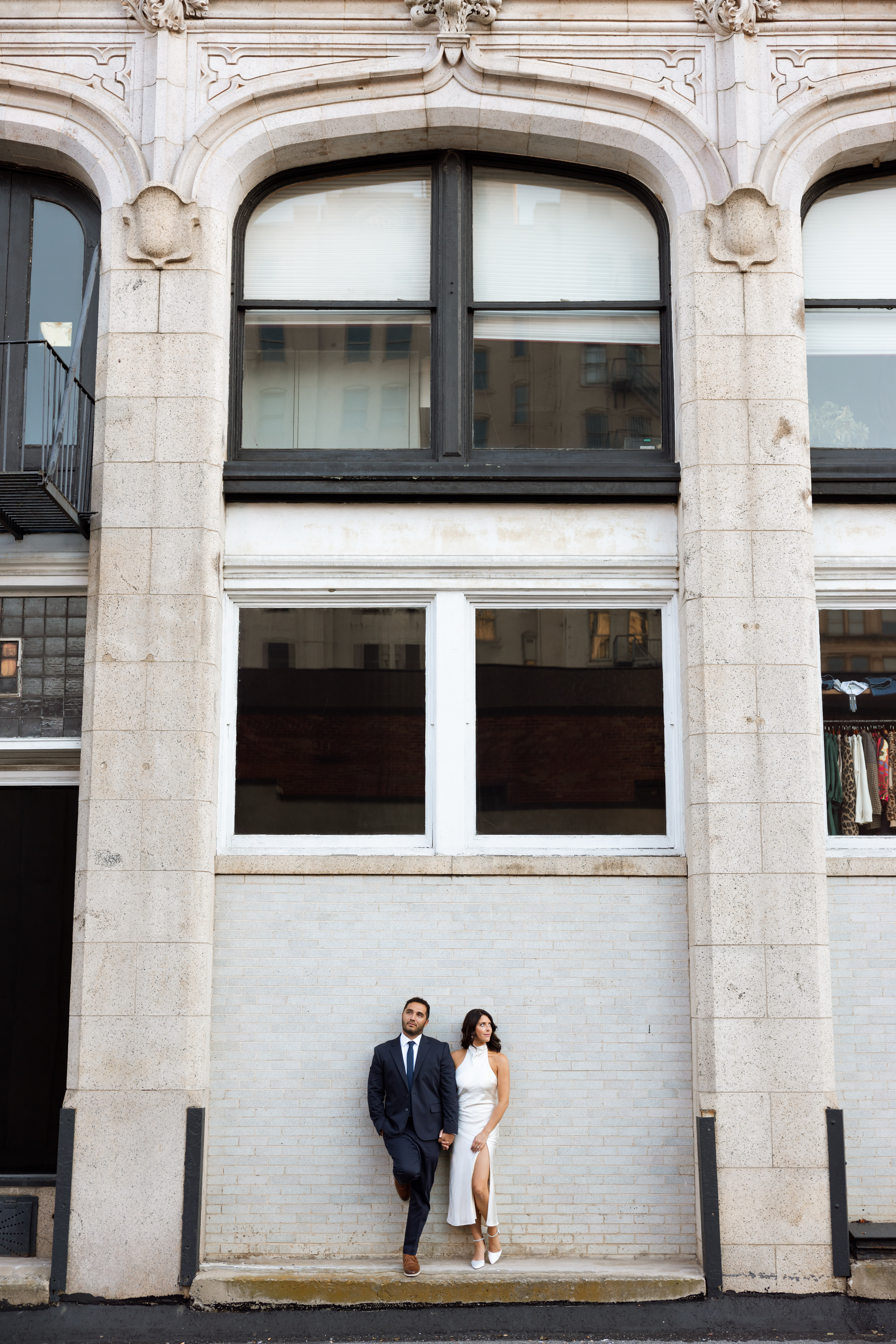 Engagement photos in Scranton, PA featuring city architecture and downtown vibes