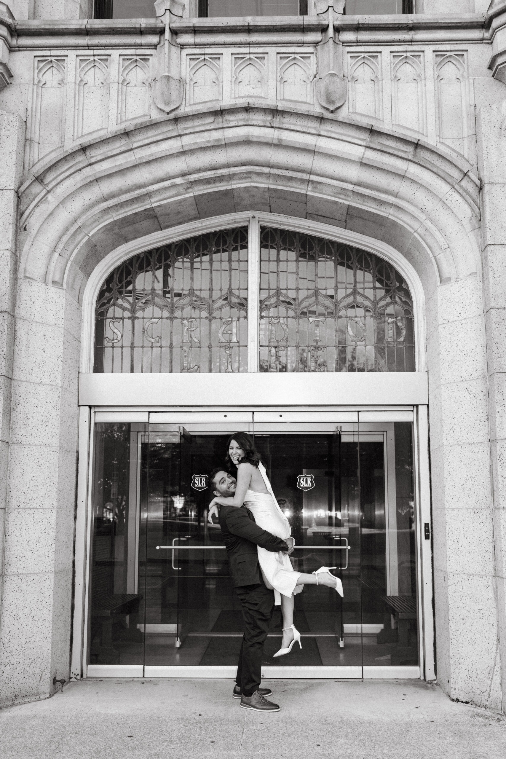 Engagement photos in Scranton, PA featuring city architecture and downtown vibes