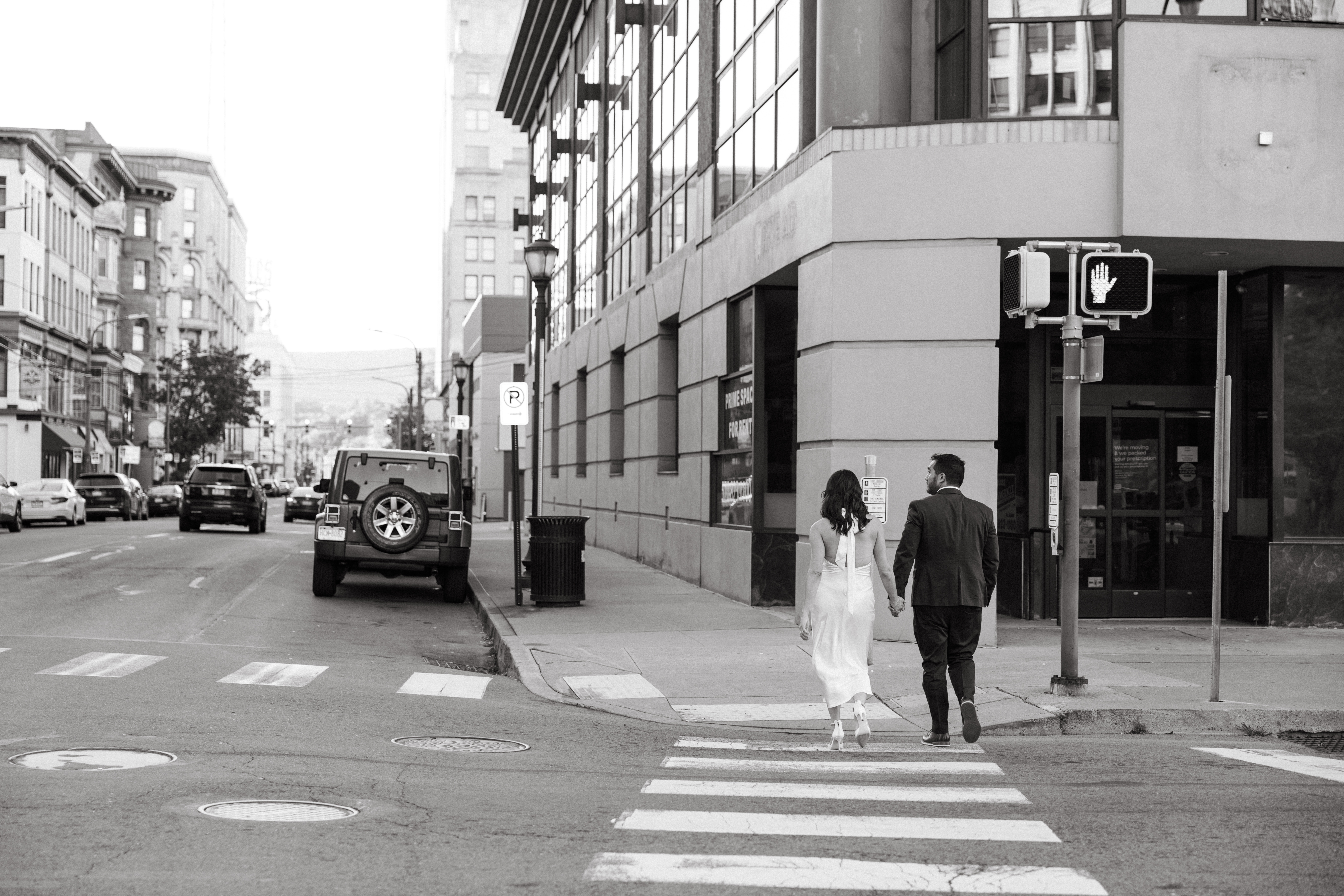 Engagement photos in Scranton, PA featuring city architecture and downtown vibes