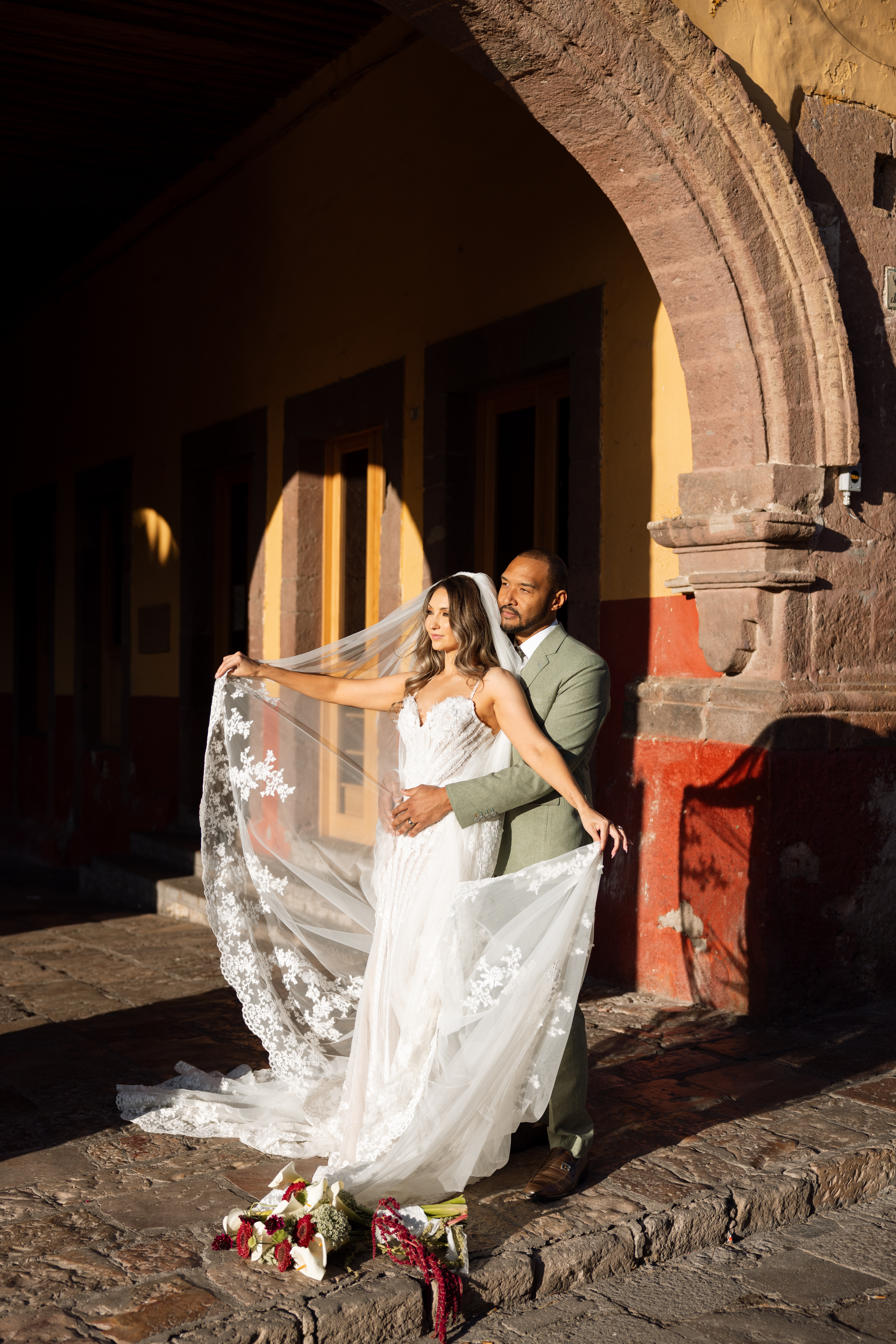 Couple walking through San Miguel de Allende just after getting married