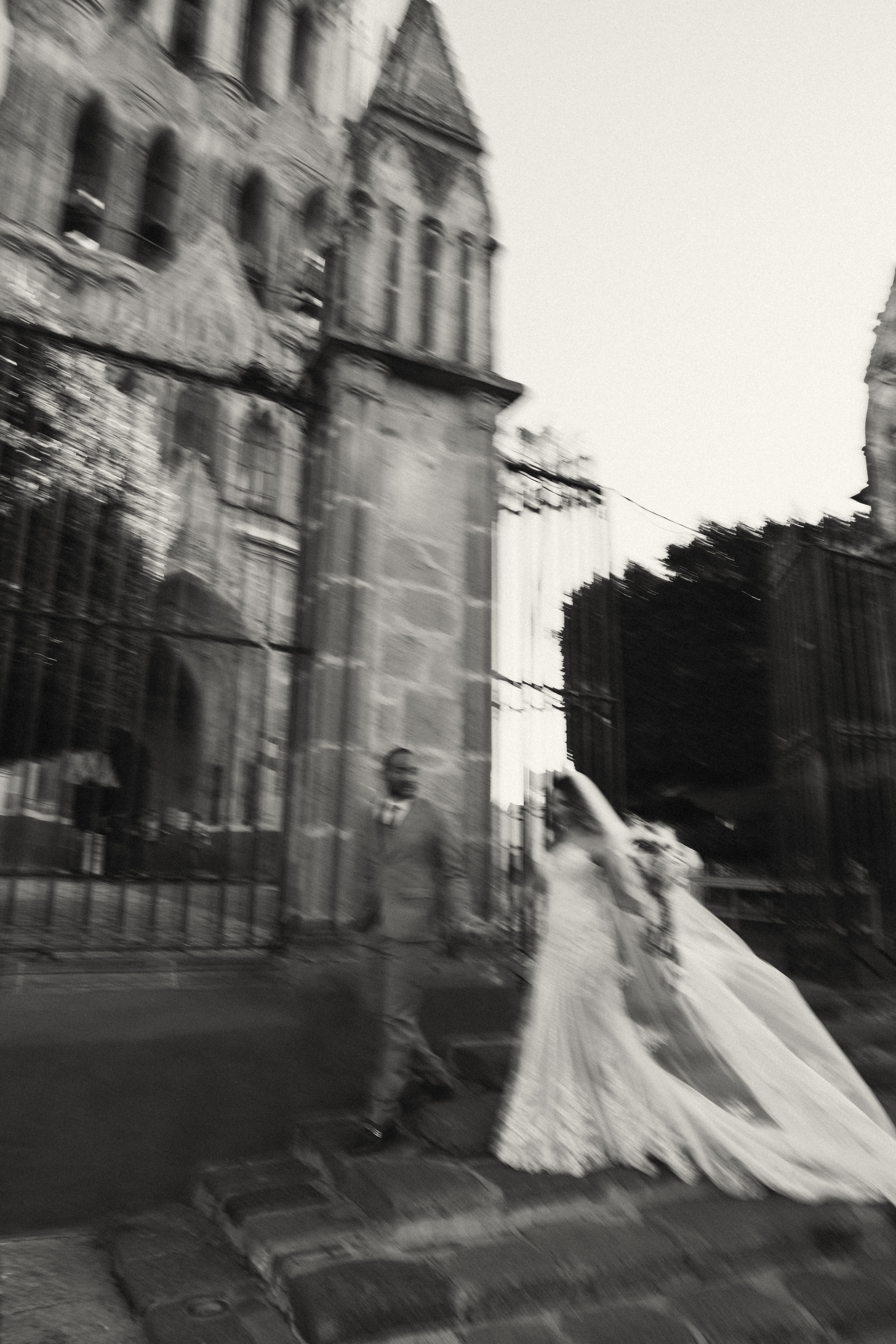 Couple walking through San Miguel de Allende just after getting married