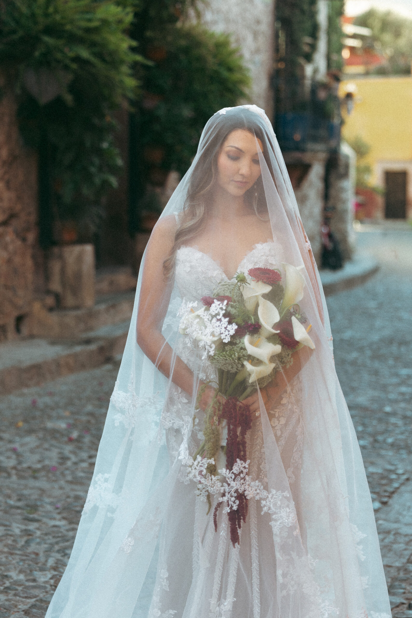 Couple walking through San Miguel de Allende just after getting married