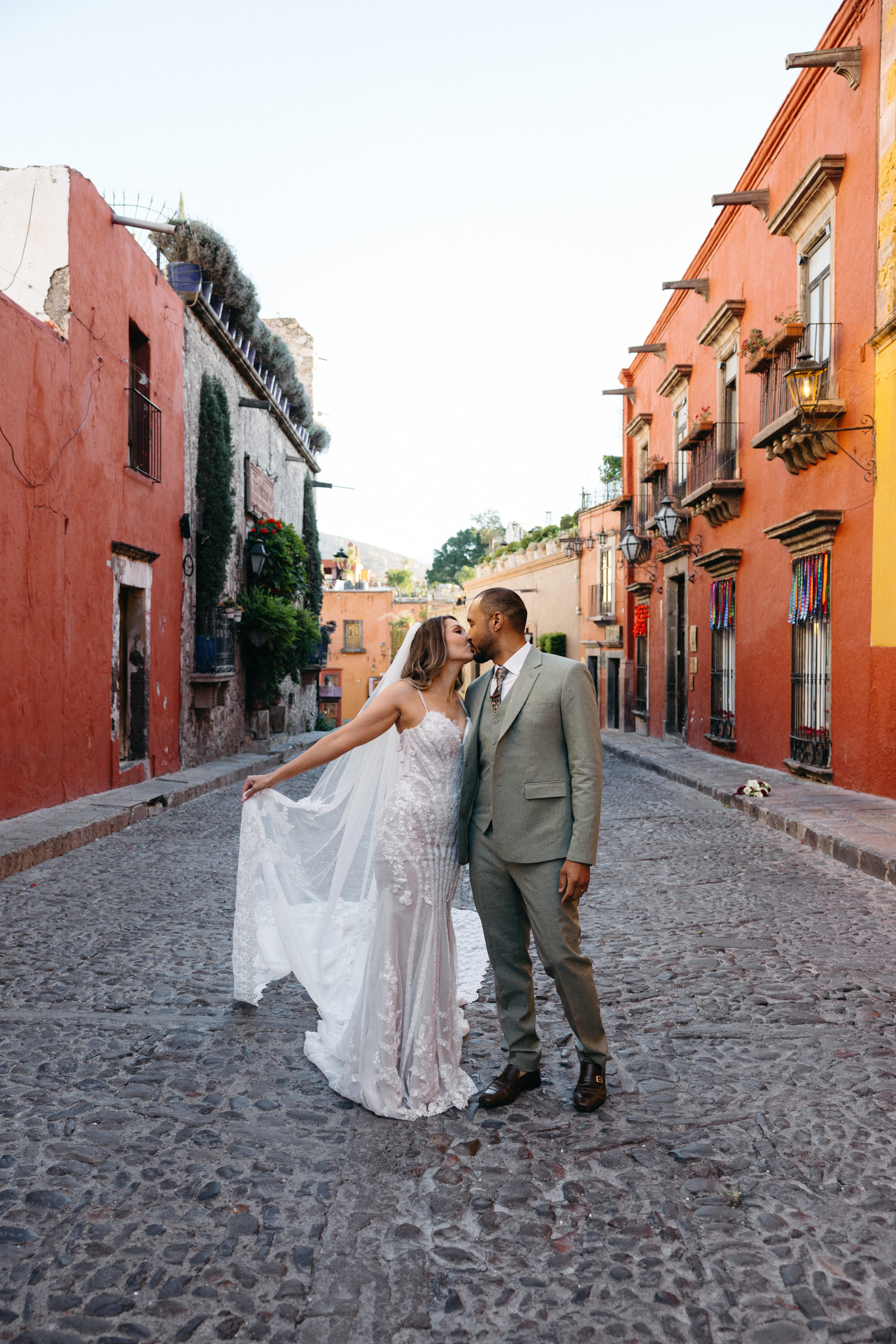 Couple walking through San Miguel de Allende just after getting married