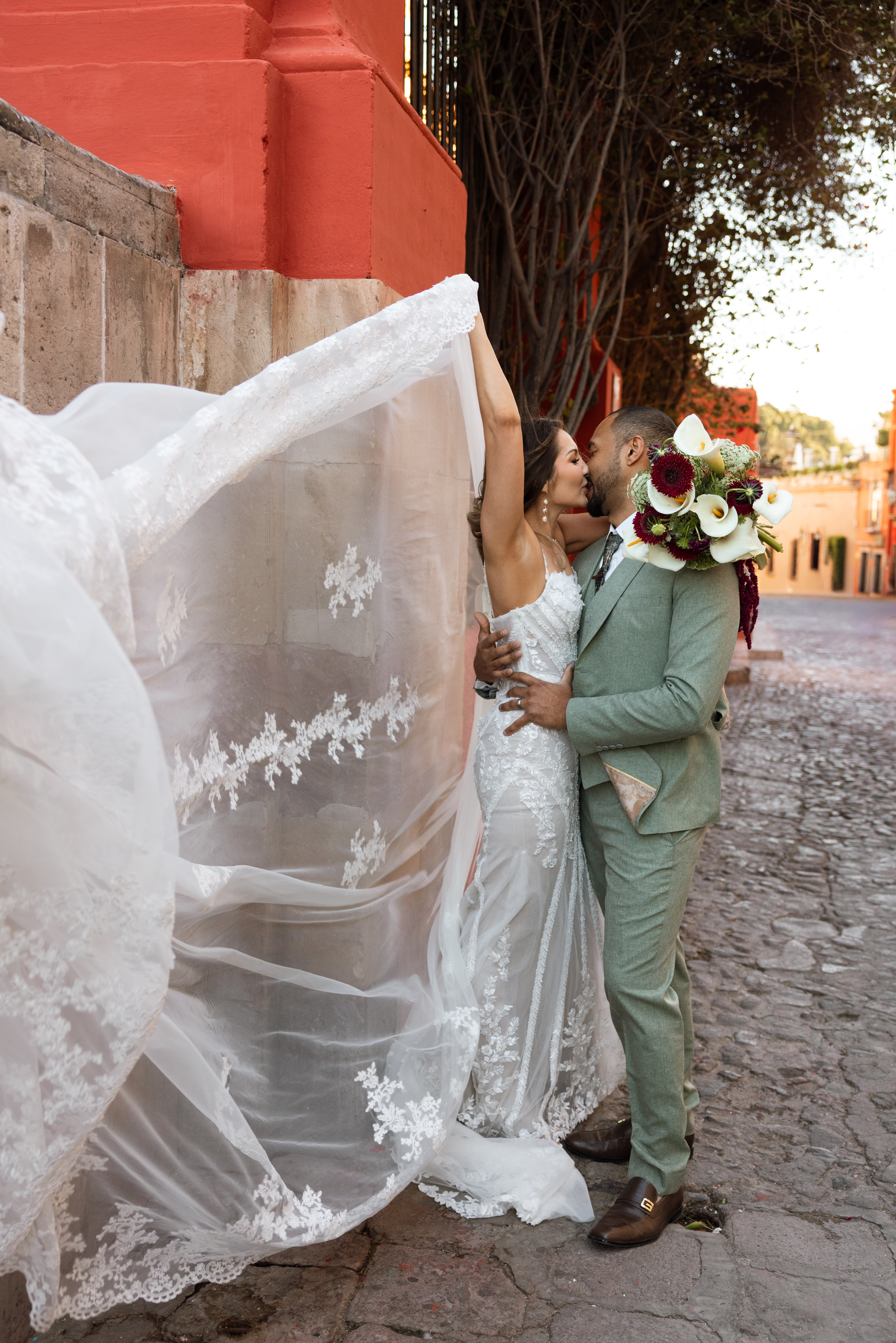 Couple walking through San Miguel de Allende just after getting married