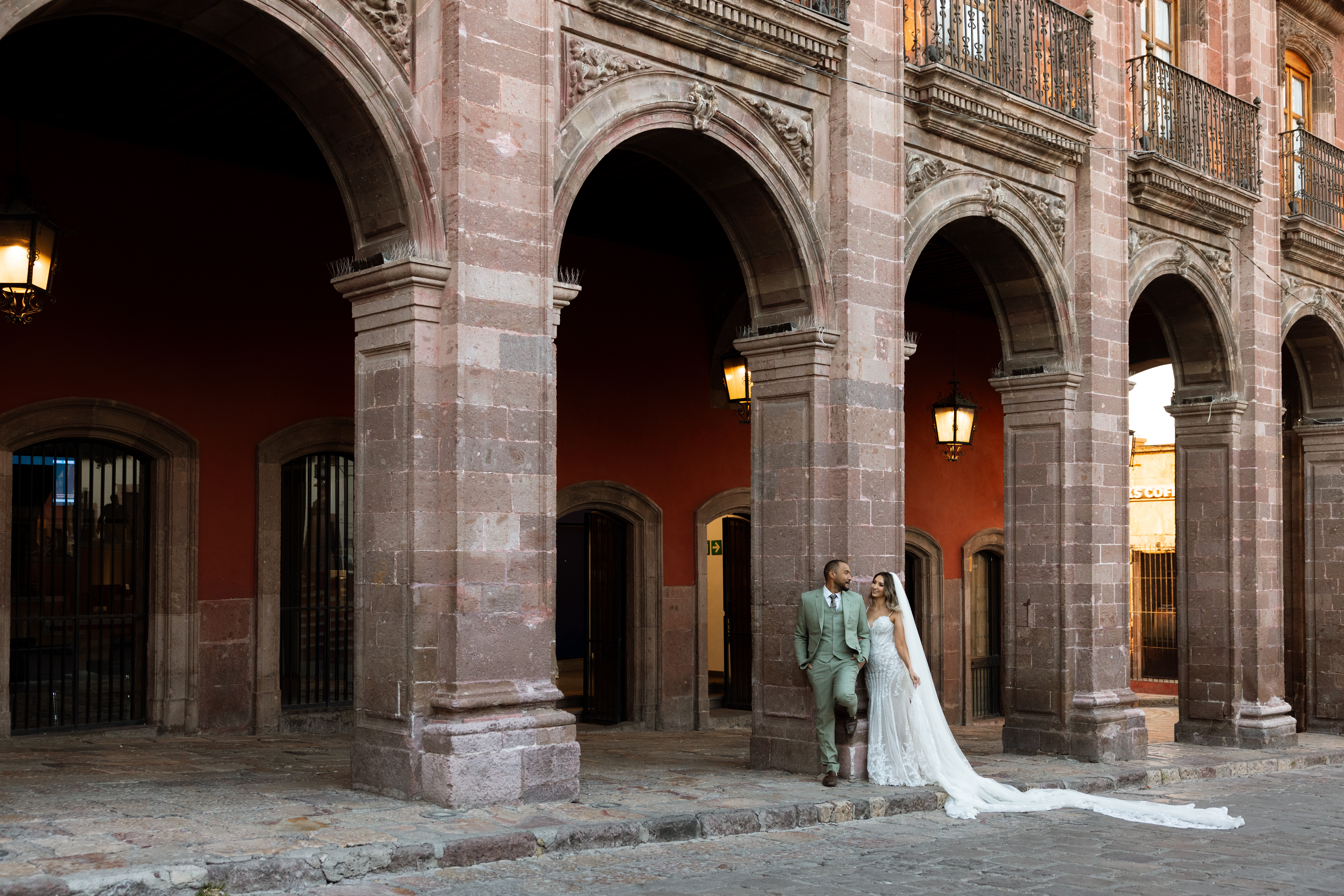 Couple walking through San Miguel de Allende just after getting married