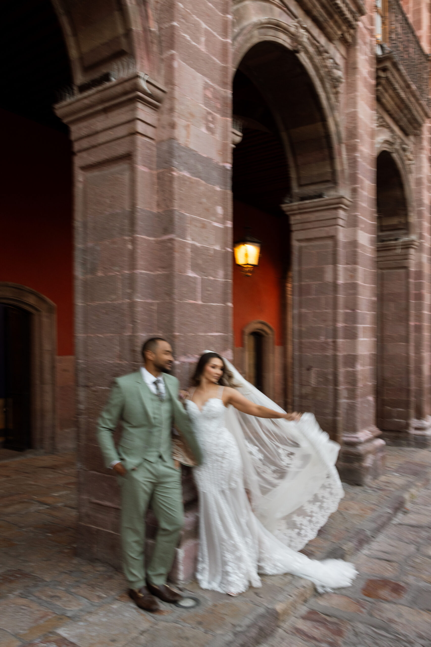 Couple walking through San Miguel de Allende just after getting married