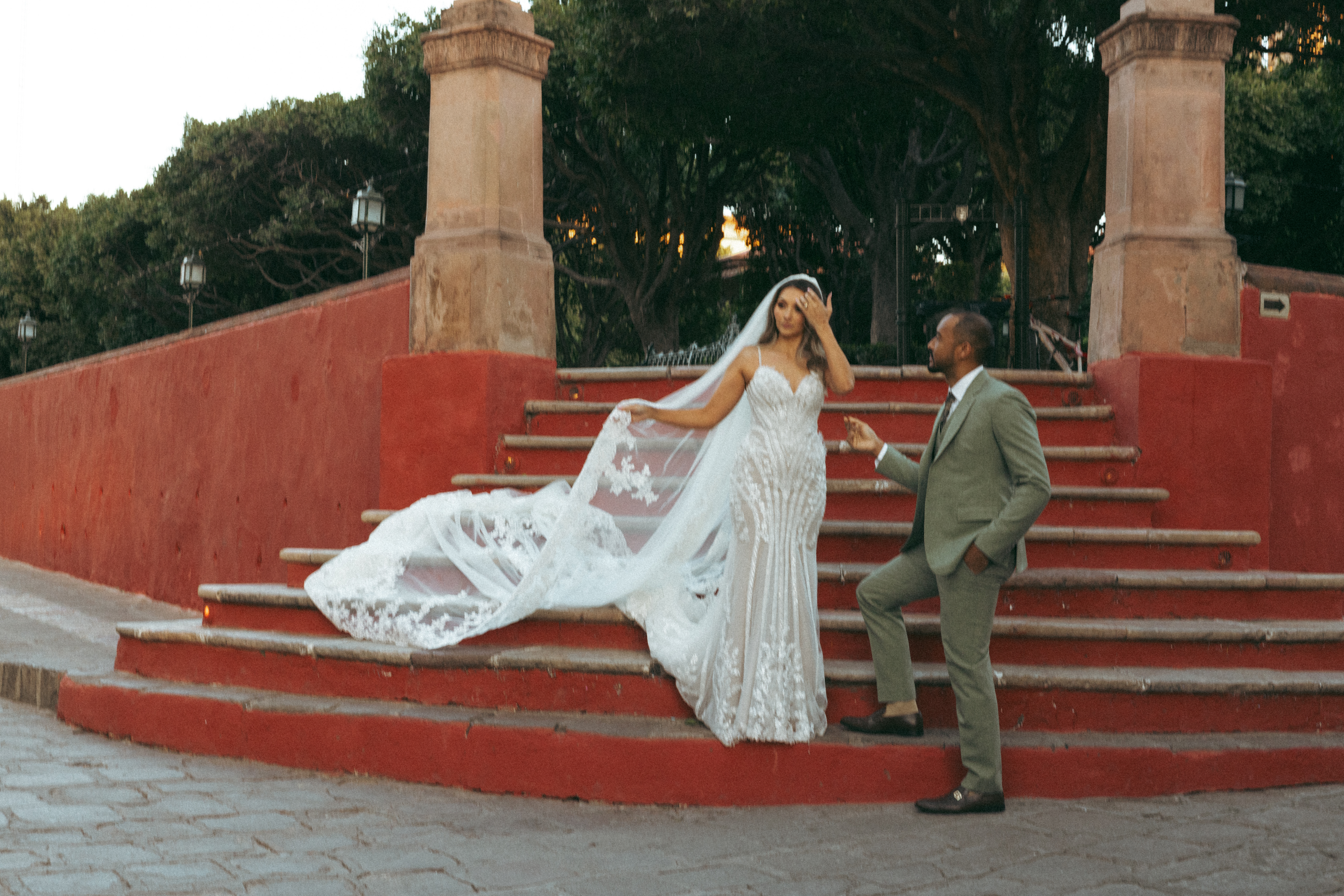 Couple walking through San Miguel de Allende just after getting married