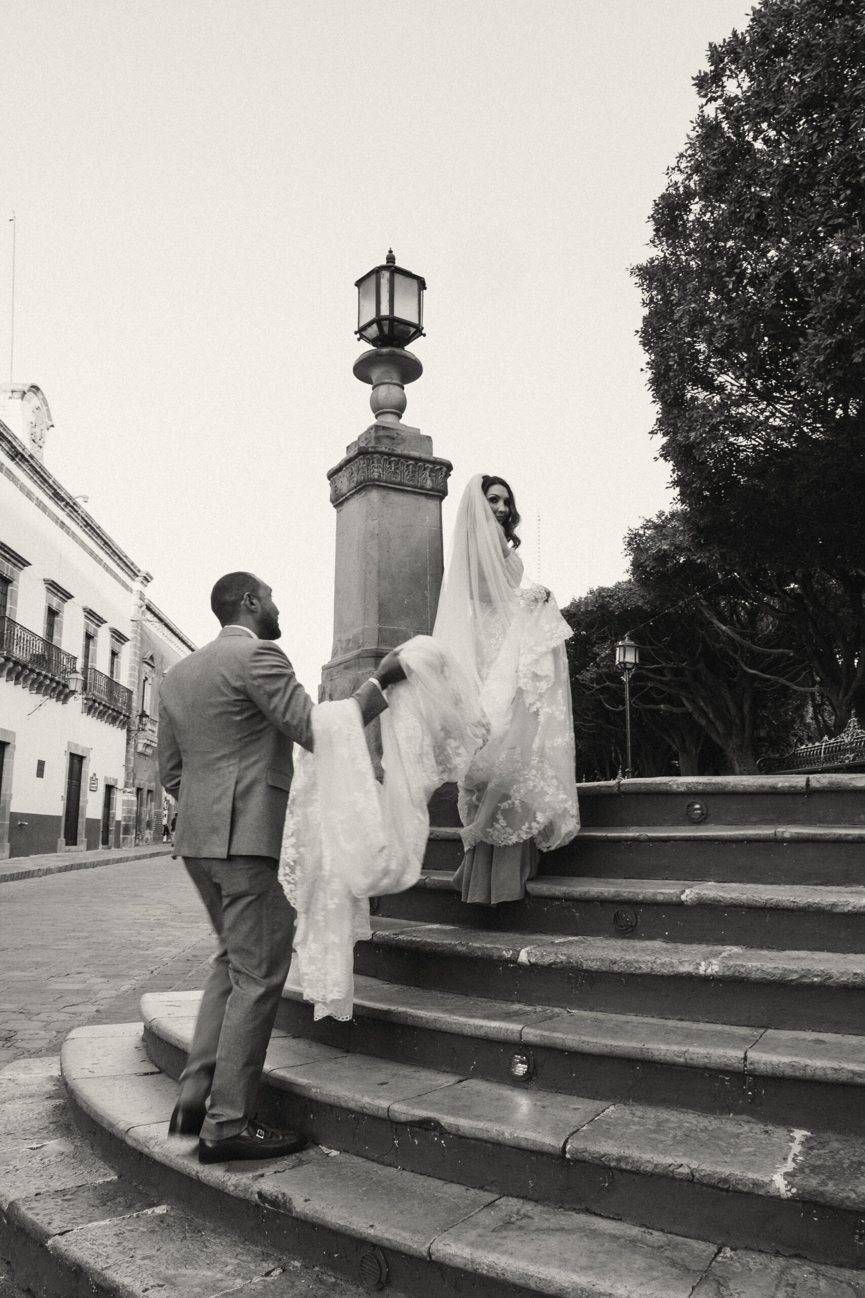 Couple walking through San Miguel de Allende just after getting married