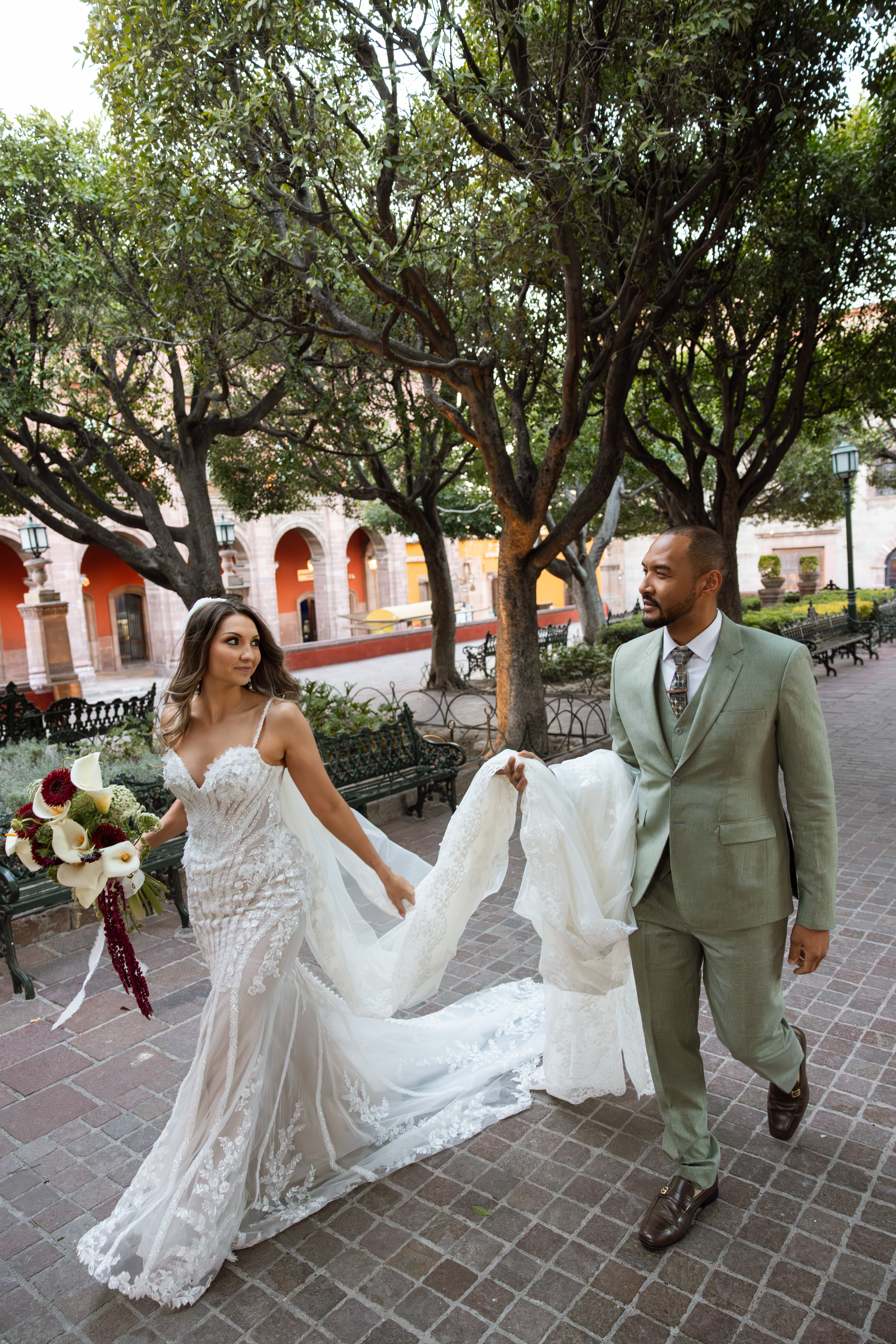 Couple walking through San Miguel de Allende just after getting married