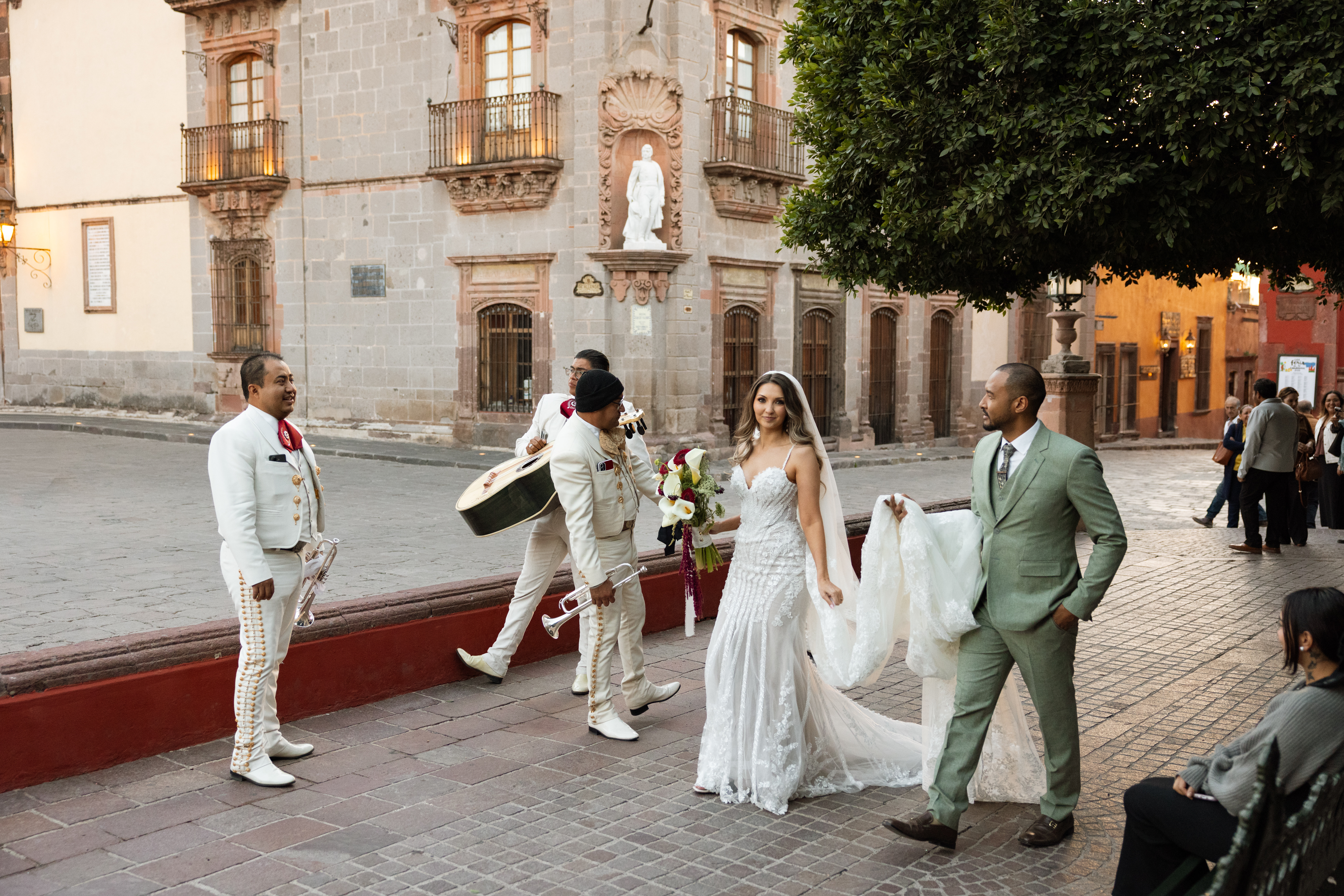 Couple walking through San Miguel de Allende just after getting married