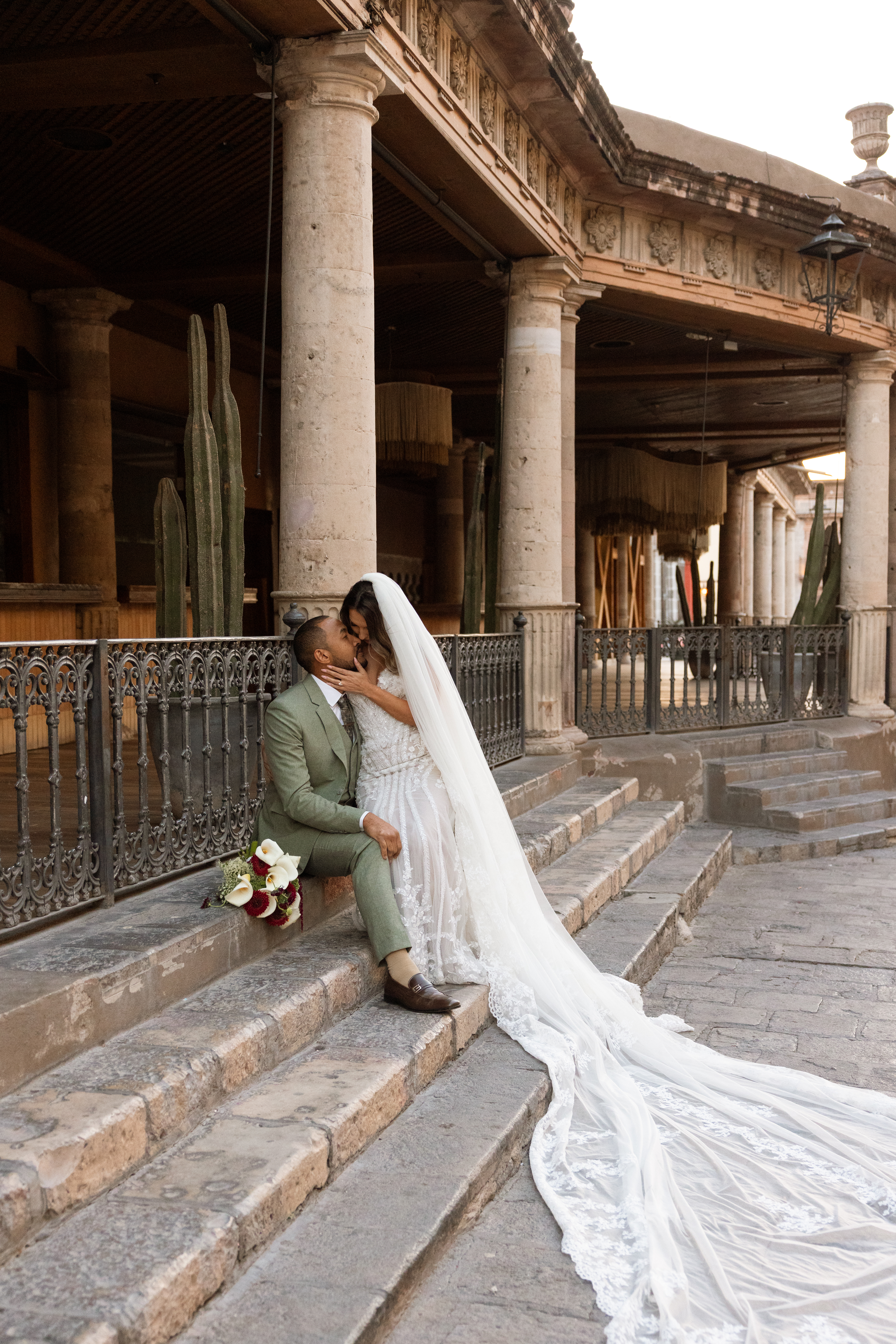 Couple walking through San Miguel de Allende just after getting married
