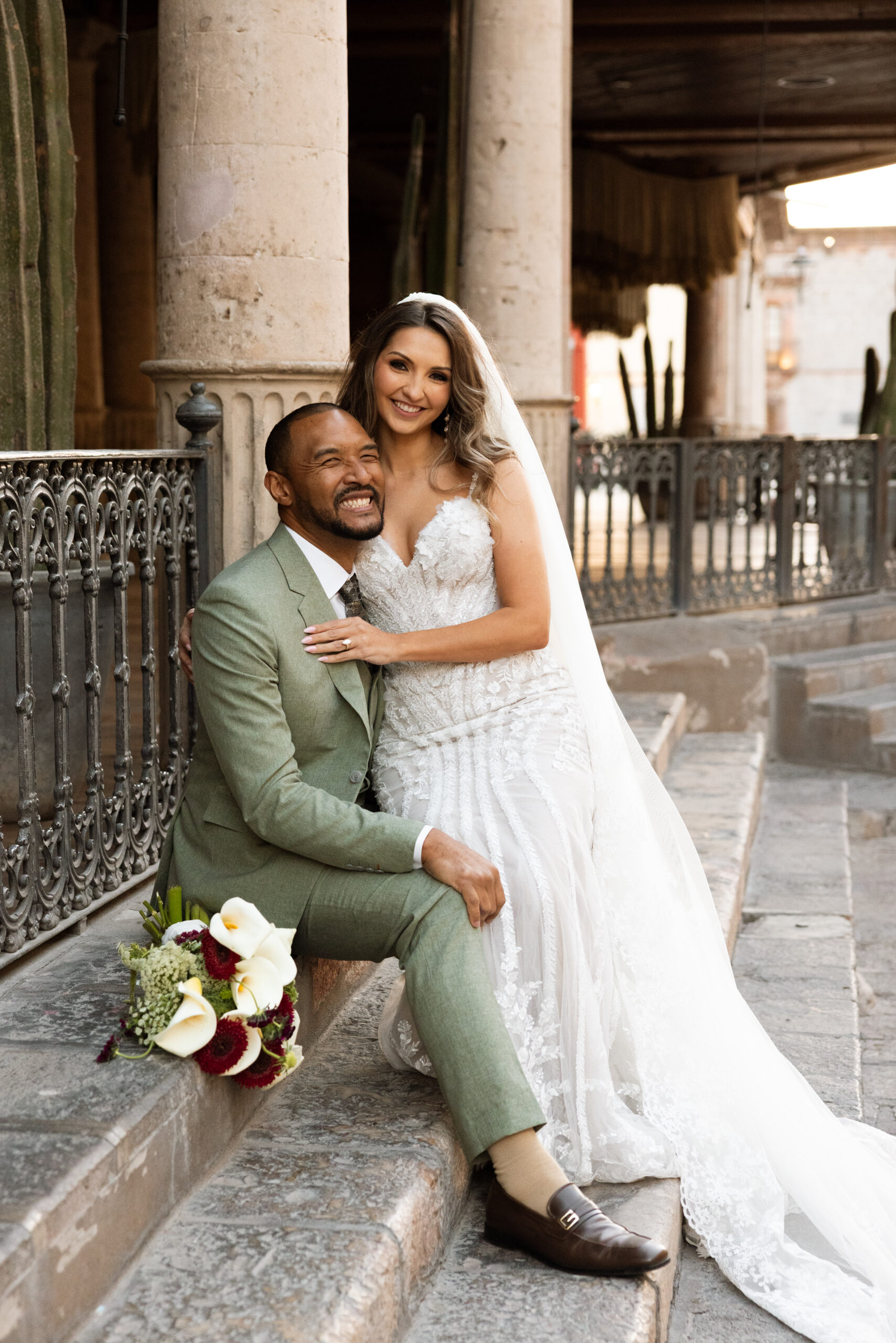 Couple walking through San Miguel de Allende just after getting married