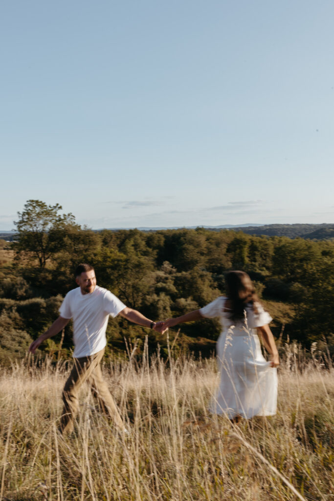 Natural, candid field couple photos created through guided prompts in Lehigh Valley Pennsylvania at golden hour